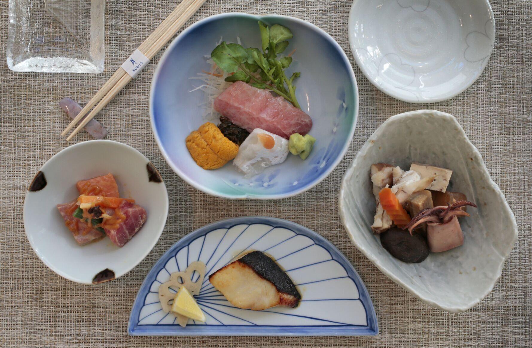 Clockwise from top: sashimi, takiawase, gin-dara and nuta at Nobu's in University City